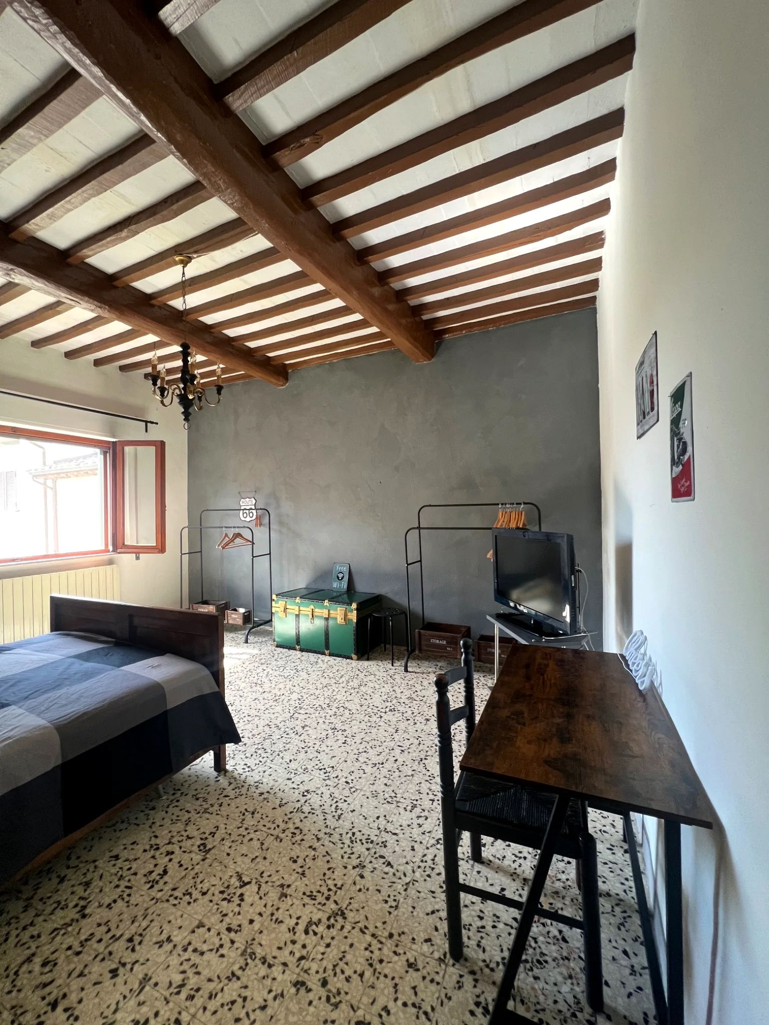 Second bedroom with window and beams