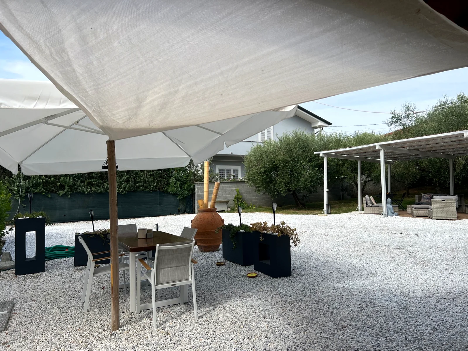 Covered pergola lounge at Villa Versilia